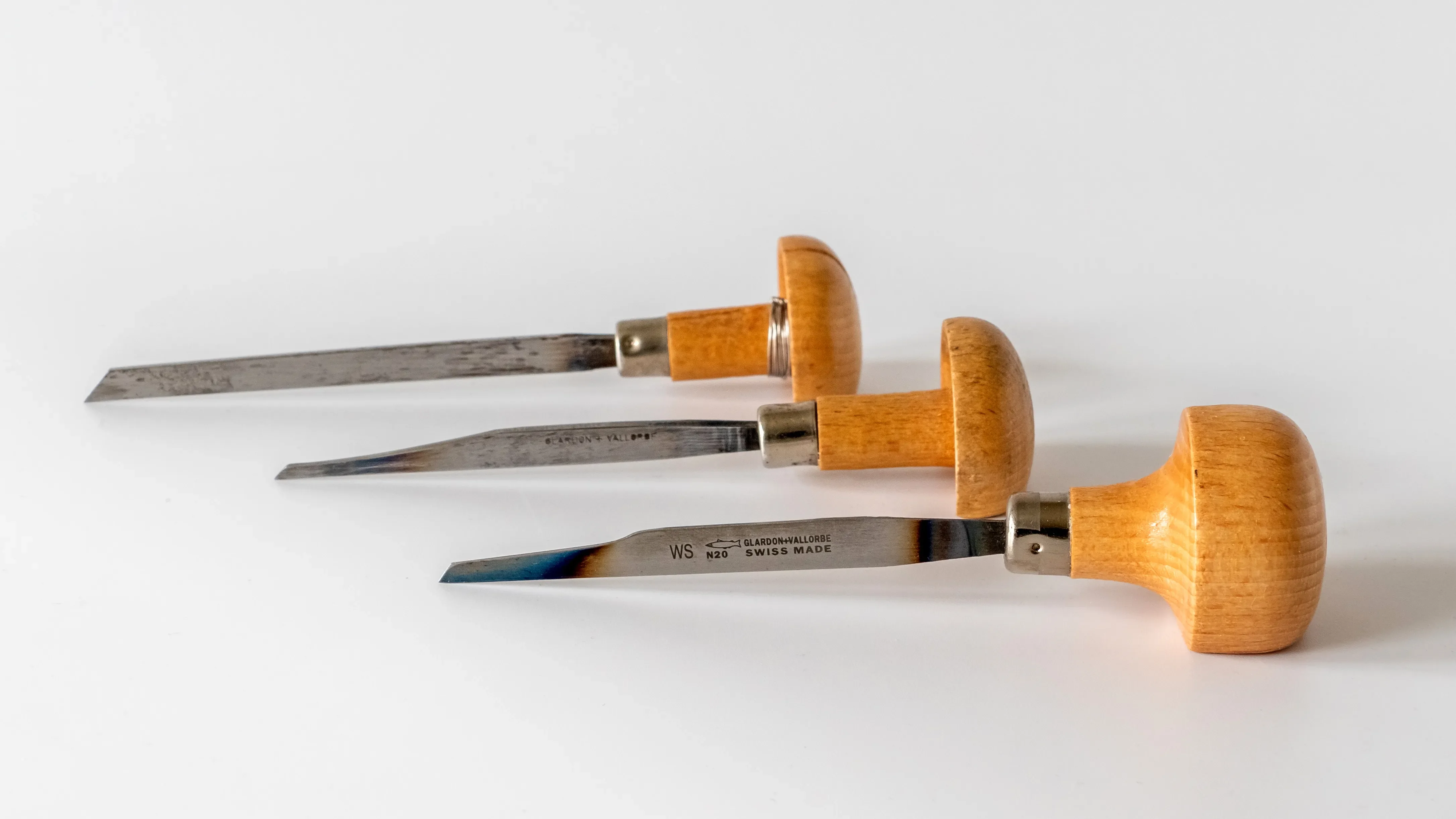 Three steel engraving burins with mushroom-shaped handles